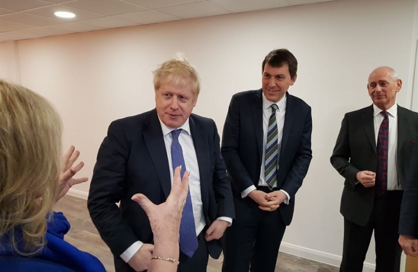 Boris Johnson standing next to John