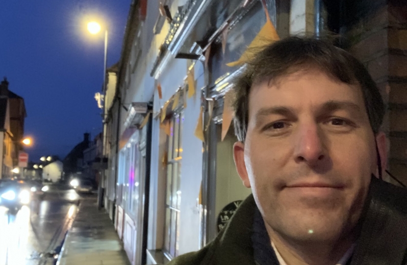 Photograph of John outside shops on Small Business Saturday