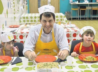 John at cookery class with primary age children