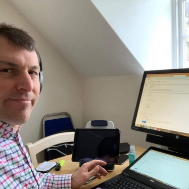 John working at his desk